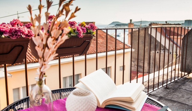 Breathtaking balcony view of the historic city center and the Adriatic sea in Split