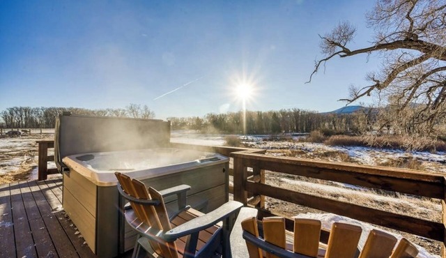 Dog-friendly riverfront retreat with hot tub, stunning views & screened porch in South Fork
